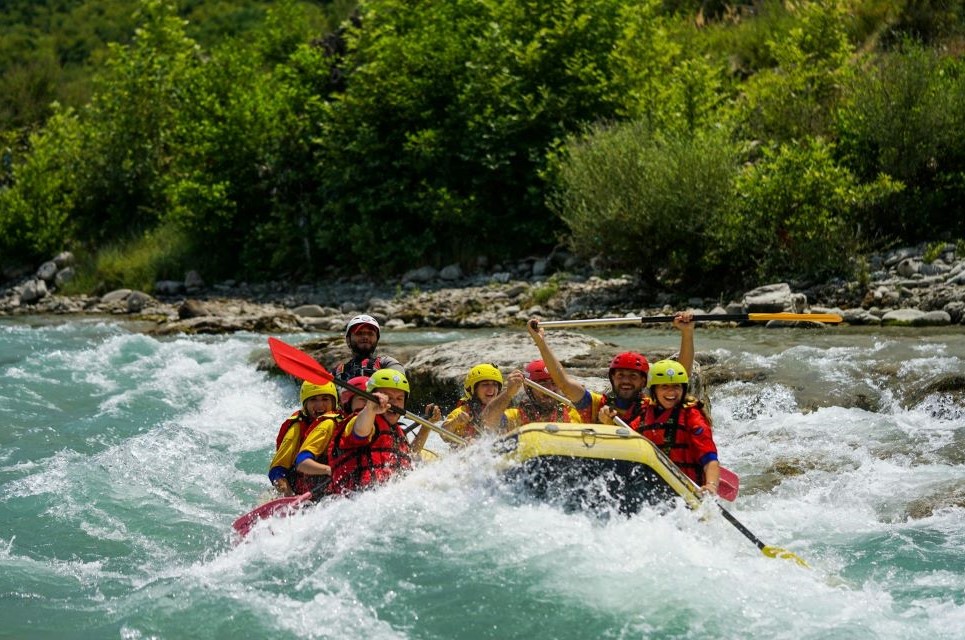 People riding on yellow kayak